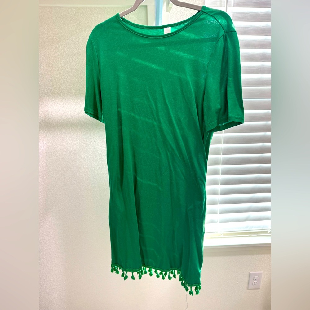 Green t-shirt dress with pockets and tassel hem, size large